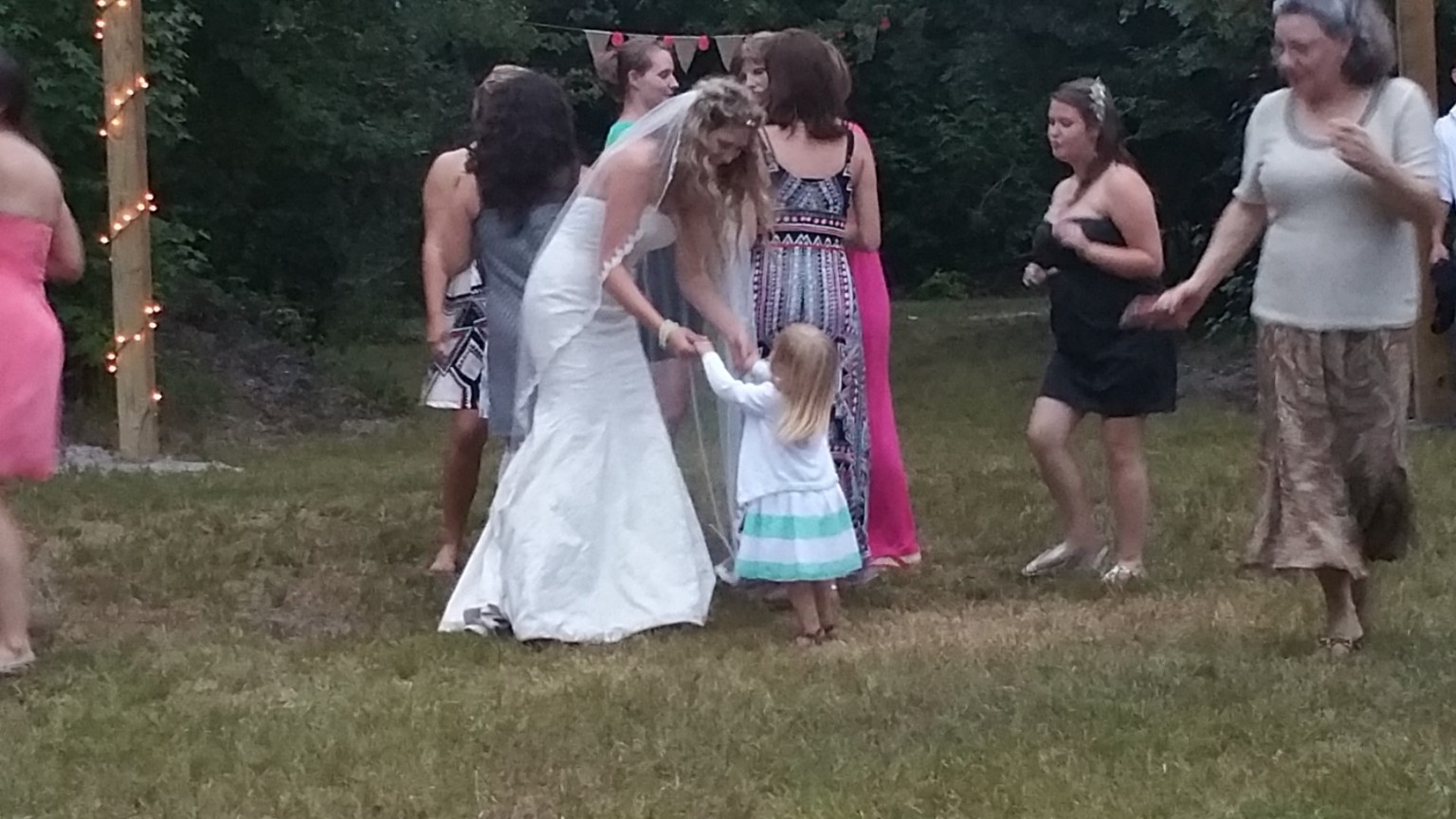 Guests gathered in the wooded event area